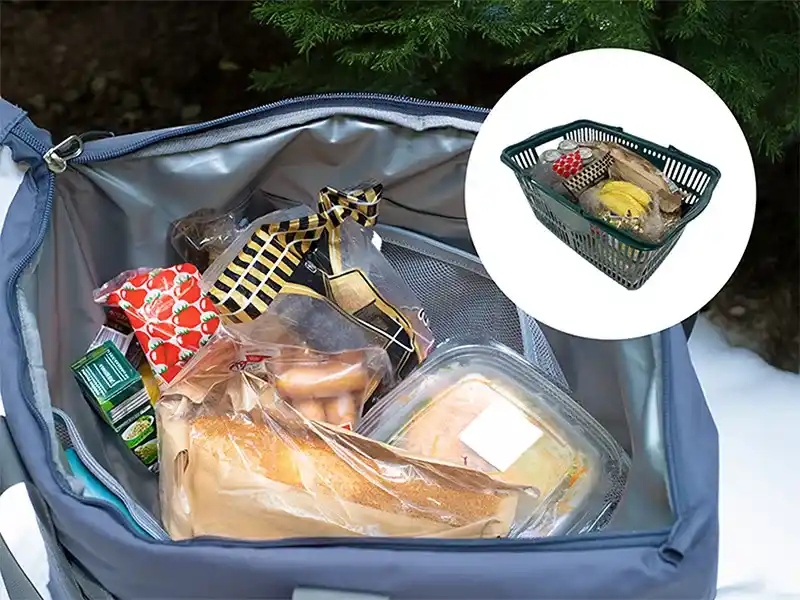買い物カゴ一杯分の食材を入れたDOD「ヒャドメシーレ」のファスナーを開けた状態の写真。